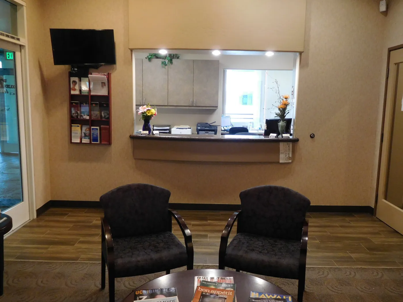 The front desk and check-in window at Golden Triangle Dentistry