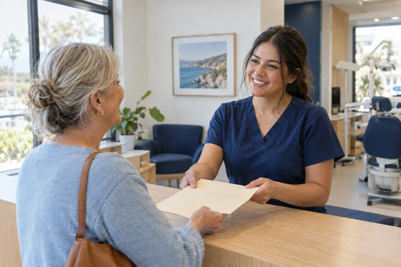 A team member handing a folder to a longtime patient